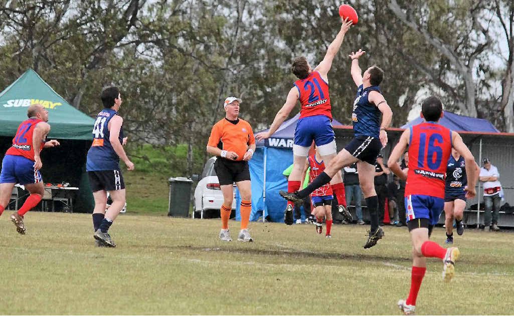 Redbacks player Alex Cutmore (21) goes for the ball against Coolaroo at Roddie’s Oval. Redbacks player Alex Cutmore (21) goes for the ball against Coolaroo at Roddie’s Oval.